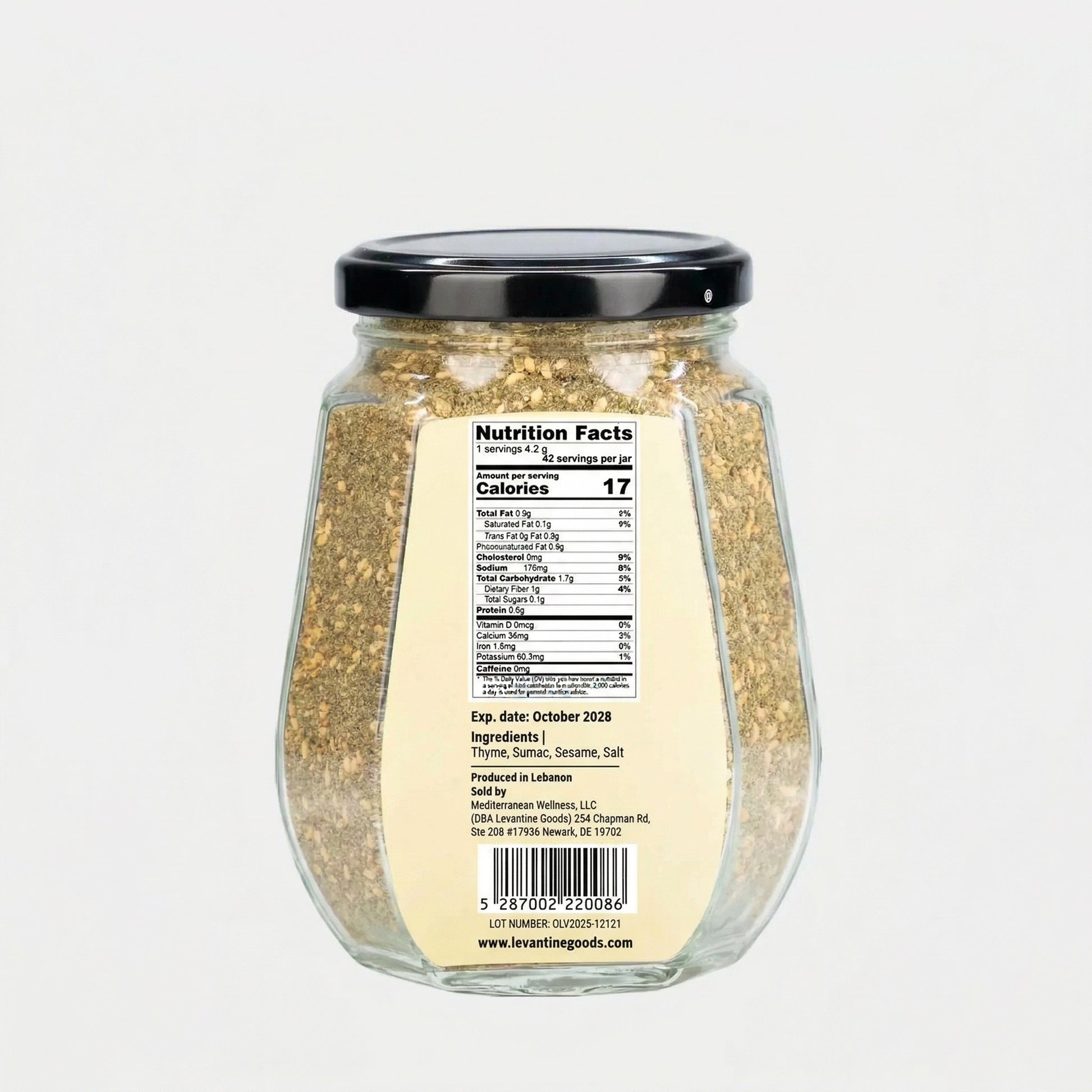 Glass jar with nutritional label on a white background
